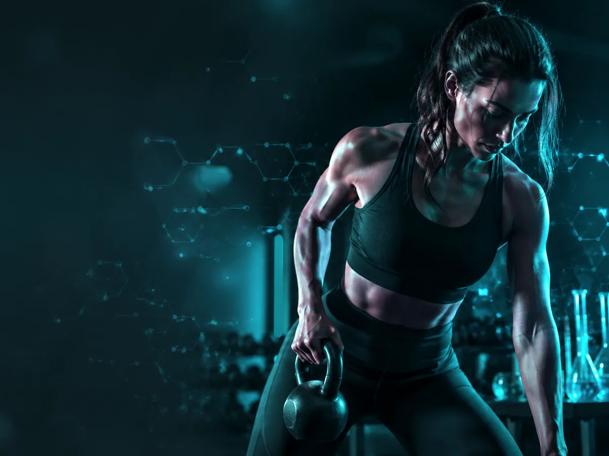 Adult female athlete training with a kettlebell